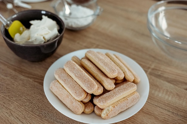 Ingredients for cooking tiramisu Savoiardi biscuit cookies mascarpone cream sugar