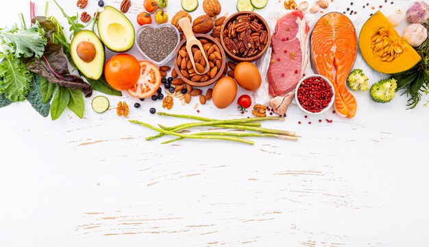 Photo  ingredients for healthy foods selection on white wooden background.