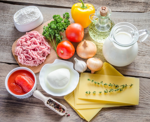 Ingredients for lasagne on the wooden table