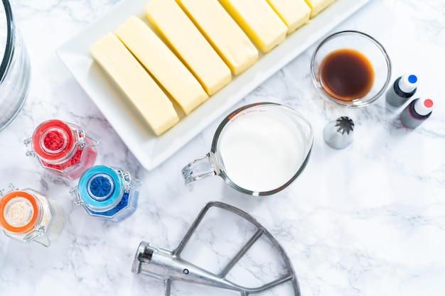 Ingredients to make buttercream frosting for decorating a cake.