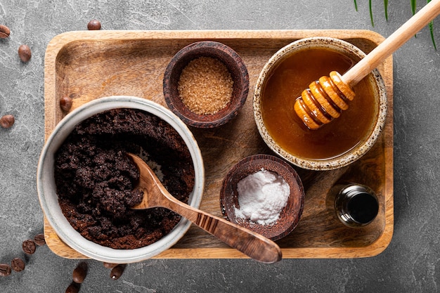 Ingredients for making homemade coffee skincare scrub on gray background eco friendly cosmetics