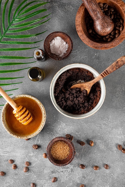 Ingredients for making homemade coffee skincare scrub on gray background eco friendly cosmetics