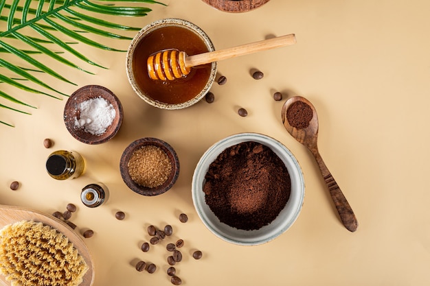 Ingredients for making homemade coffee skincare scrub on plain natural background eco friendly