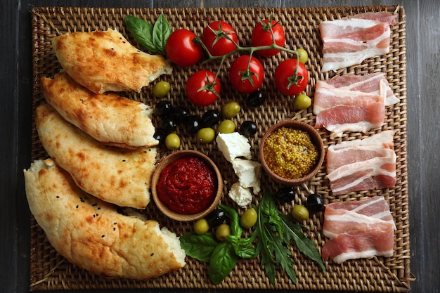 Ingredients of Mediterranean cuisine on wooden board top view