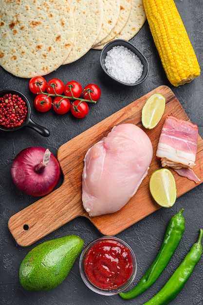 Ingredients for Mexican tacos with chicken meat and corn tortilla