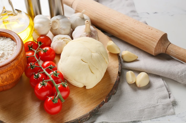 Ingredients for pizza on light surface