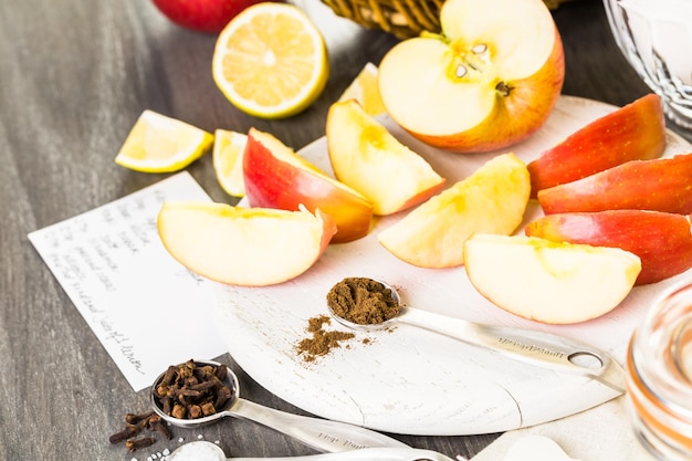 Ingredients for preparing homemade apple butter from organic apples.