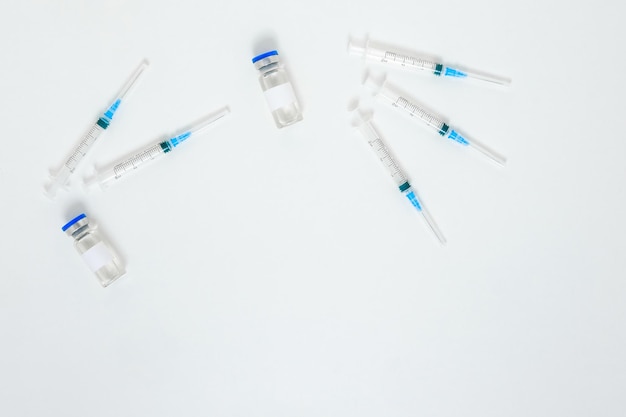 Injection for prevention virus and health careInfluenza vaccine Flat lay of syringes and bottles