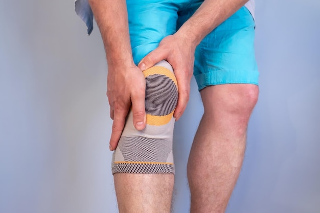 Injured knee joint with a special fixator that stabilizes the problem area holding the injured leg