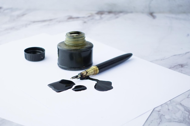 Photo ink empty paper and fountain pen on table