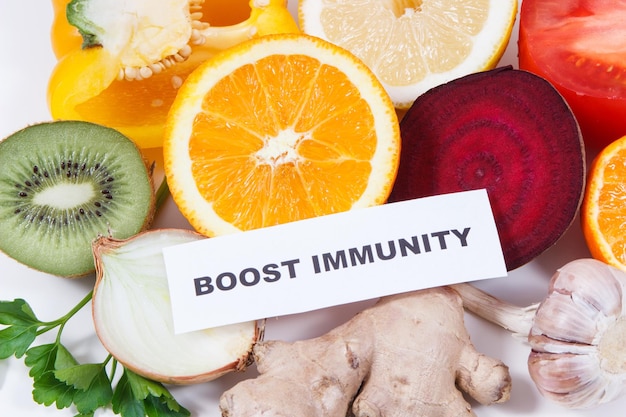 Photo inscription boost immunity fresh ripe healthy fruits and vegetables containing natural vitamins immune boosting in times of covid19