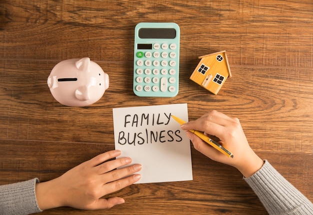 The inscription family business next to a droplet a house and a calculator