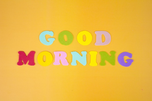 The inscription Good morning in multicolored letters on a yellow background