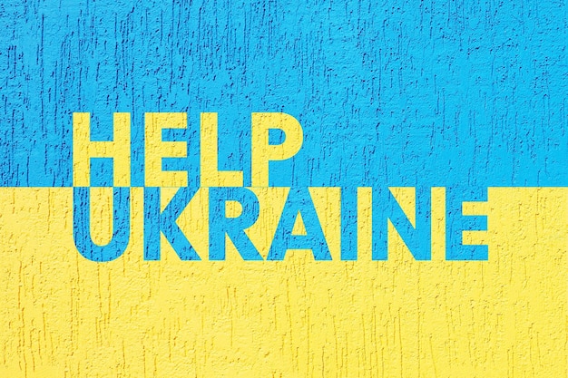 The inscription help Ukraine in yellow and blue on the background of the Ukrainian flagxA