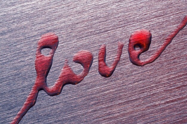 Inscription love on a metal surface