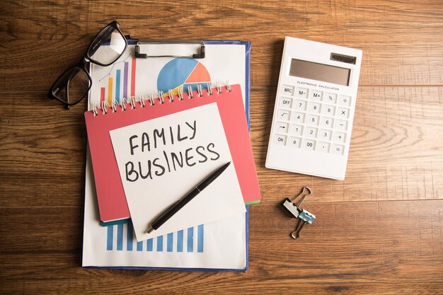 Inscription on paper family business graph and calculator