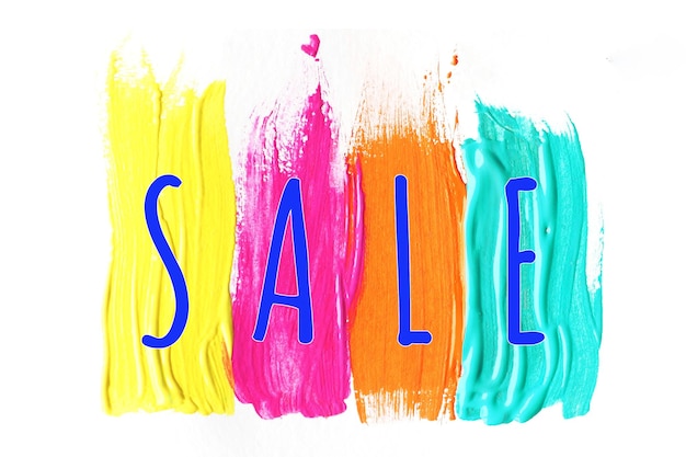 The inscription SALE on bright multicolored strokes of paintxA