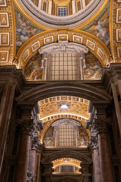 The inside of a church with gold and white decorations