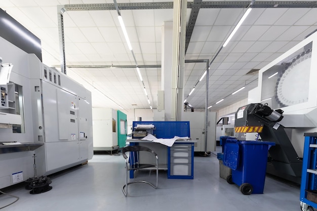 Inside of factory unit working place of engineer near computerized equipment