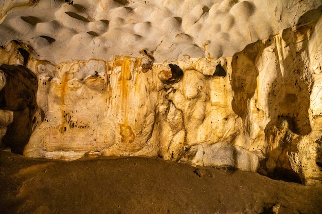 Inside view of Karain Cave in Antalya, with natural stalactites and stalagmites around in Turkey