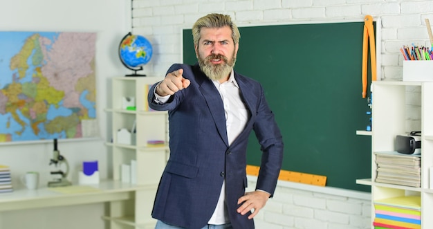 Inspiration and forcing Back to school Emotional bearded man in classroom chalkboard Students must pass final examination Teacher school lesson Study and education Modern school Knowledge day