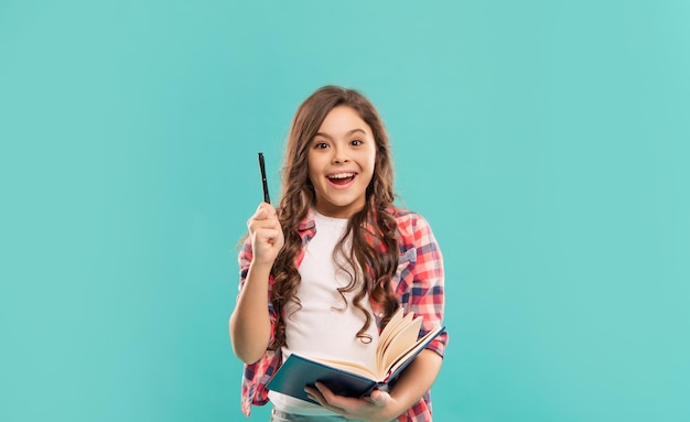 Inspired with idea teen girl study with book. child holding copybooks.