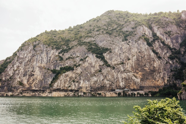 Inspiring scenery with rocks at Iseo Lake in Italy.