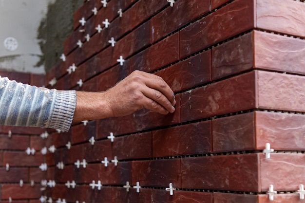 Installation of facing facade tiles