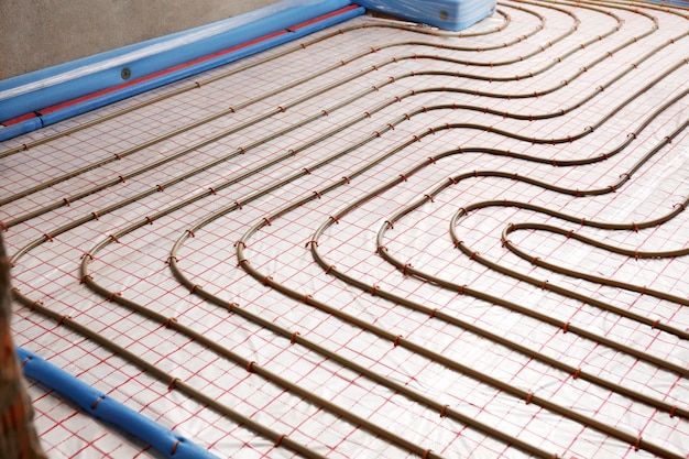 Installation of underfloor heating system in building