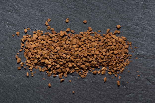 Instant arabica coffee on a beautiful black background