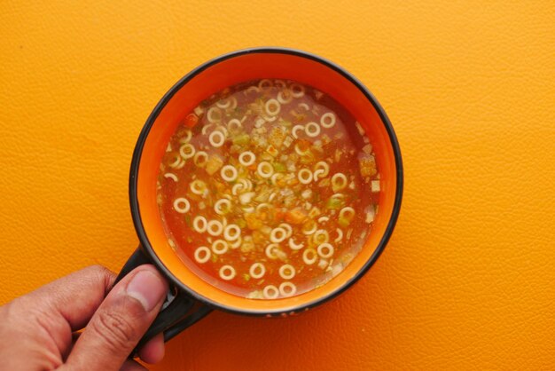 Instant cup soup in a mug on table