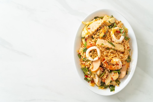 Instant noodle spicy salad with mixed meats