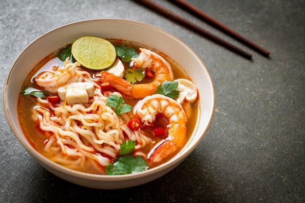 instant noodles ramen in spicy soup with shrimps (Tom Yum Kung) - Asian food style