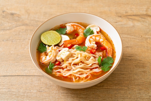 instant noodles ramen in spicy soup with shrimps (Tom Yum Kung) - Asian food style