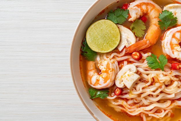 Instant noodles ramen in spicy soup with shrimps Tom Yum Kung