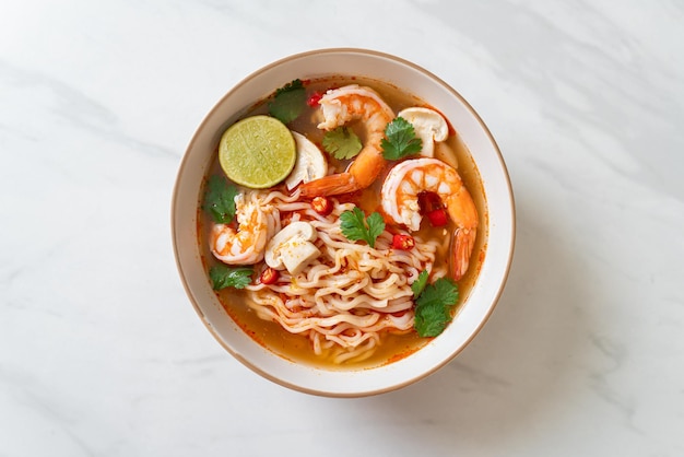 instant noodles ramen in spicy soup with shrimps Tom Yum Kung