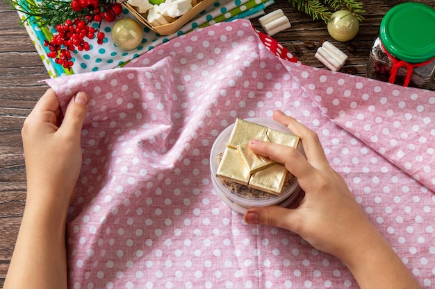 Instruction step 2 Furoshiki Japanese traditional gift wrapping demonstration Handmade