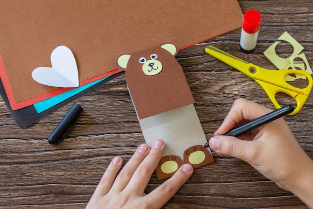 Instruction step 9 On Mothers Day or Valentines Day gift a teddy bear with a heartcard