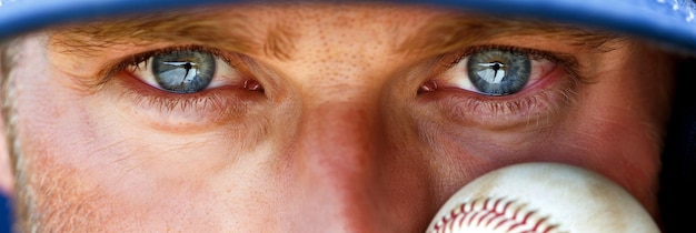 Intense concentration baseball player s eyes locked on fly ball in the outfield