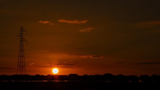 Intense sunset with electric tower as the protagonist