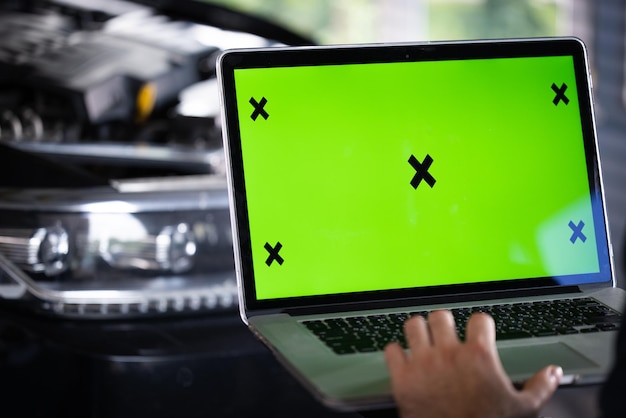 Interactive diagnostics software on an advanced computer car service mechanic uses laptop computer