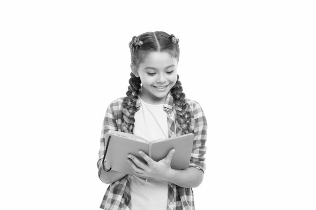 Interesting story Achieve knowledge Education concept Cute small child holding book Adorable little girl with school exercise book Preparing activity book writing Reading skills Study language