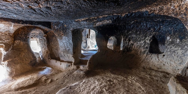 Interior of an ancient house carved into the rock in Zelve