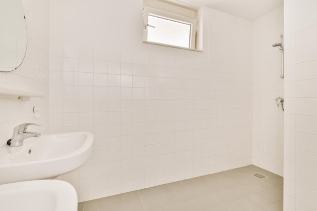 Interior of a bathroom with white tiles