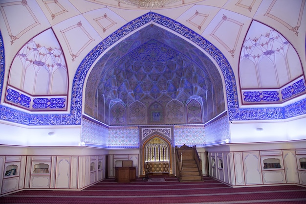 Interior of the Bolo House complex with carved wooden columns in Bukhara in Uzbekistan 05052019