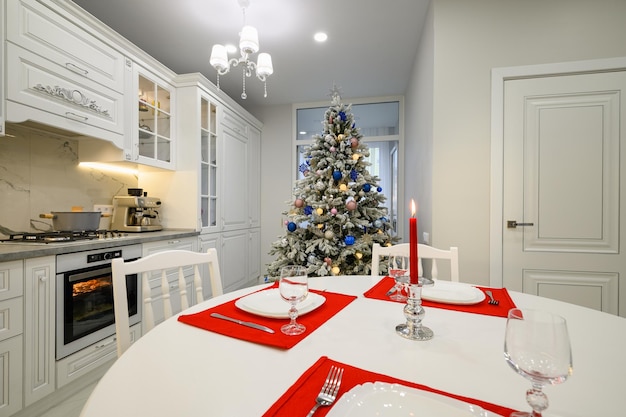 Interior of bright modern kitchen decorated for christmas