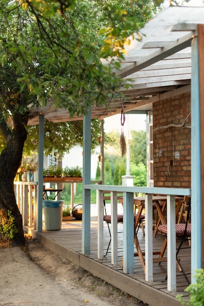 Interior cozy space in patio with wooden garden furniture for relax in outside backyard