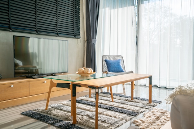 Interior design in bedroom with television and sofa with doll and light