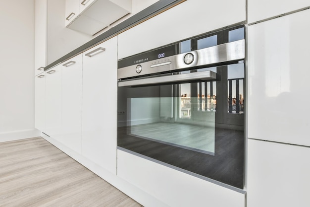 Interior design of an empty kitchen with a white kitchen set