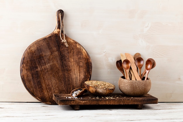 Interior design of gray kitchen wall with copper equipment and chopping board